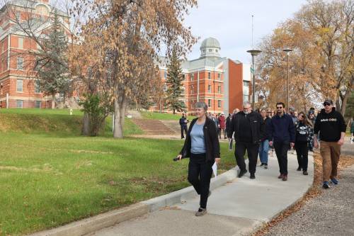Former Brandon Mental Health Centre (BMHC) tour leader Laura Crookshanks leads participants on a guided tour from the Parkland building to the former Nurses&rsquo; Residence building on Saturday afternoon. (Photos by Abiola Odutola/The Brandon Sun)