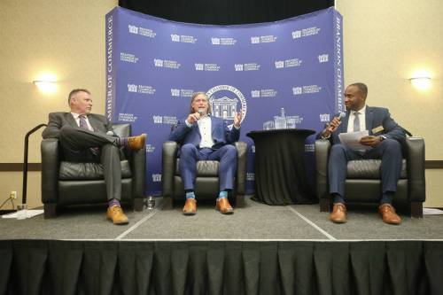 Sitting between mayoral candidate Len Isleifson (left) and Brandon Chamber of Commerce president Emelio Brown, incumbent Mayor Jeff Fawcett responds to a question during a Breakfast with the Mayoral Candidates event hosted by the Chamber at the Victoria Inn on Wednesday morning. (Matt Goerzen/The Brandon Sun)