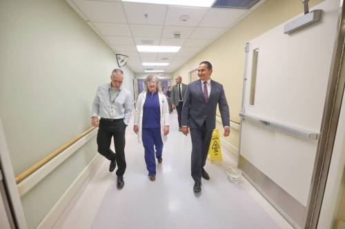 Scott Kirk, director of operations for the Brandon Regional Health Centre (from left), walks with Dr. Arleigh Trainor and Manitoba Premier Wab Kinew down a hallway during a tour of the Brandon Regional Health Centre&rsquo;s emergency department on Thursday afternoon, after the province&rsquo;s doctor recruitment announcement for Prairie Mountain Health. (Photos by Matt Goerzen/The Brandon Sun)