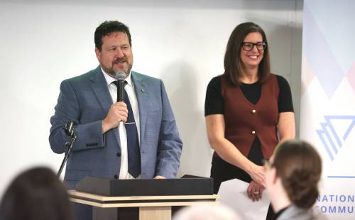 Municipal and Northern Relations Minister Glen Simard talks to the audience during the YWCA Westman&rsquo;s $40-million women&rsquo;s campus community launch, while YWCA chief executive officer Lois Ruston looks on. (Abiola Odutola/The Brandon Sun)