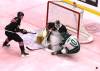 Everett Silvertips forward Henri Ament (10) slams on the brakes before he runs into Brandon Wheat Kings goalie Filip Ruzicka (30) as defenceman Cole Slobodian (2) watched the puck bounce behind them during Western Hockey League action at Assiniboine Credit Union Place on Sunday. The ice was dyed pink for the Pink The Rink promotion to support breast cancer awareness and research. (Perry Bergson/The Brandon Sun)
                                Oct. 25, 2026