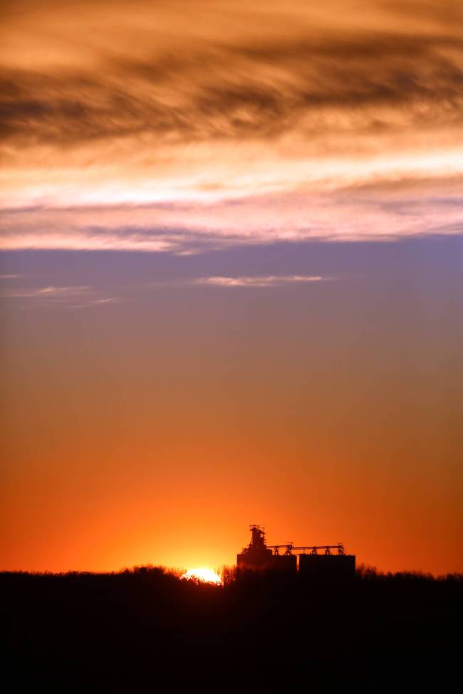 The rising sun silhouettes the Bunge grain elevator north of Forrest early Sunday morning in the Rural Municipality of Elton. (Matt Goerzen/The Brandon Sun)