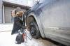 Kola Ositayo checks the tire pressure in his spare tire after changing it following having his tired slashed overnight in the parking lot of The Groves along Tracey Street in Brandon&rsquo;s south end on March 11. A total of 83 vehicles in Brandon&rsquo;s south end were damaged during the spree. (Tim Smith/The Brandon Sun files)