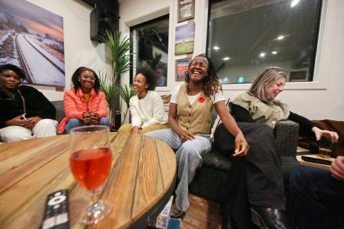 Ward 2 candidate Sonikile Tembo laughs with a supporter during her election watch party at Section 6 on Wednesday night. Tembo finished the night in second place with 232 votes, behind winner Deveryn Ross, who received 309 votes. (Matt Goerzen/The Brandon Sun)