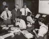 The Canadian Press became the first bilingual news agency with the inauguration of its French Service on Sept. 30, 1951, in Montreal. Standing, from left to right: Léopold Hébert, publisher; Hervé Major, president of The Canadian Press; and Alan Randal, head of The Canadian Press’s Montreal bureau. Seated, from left to right: Jean Saint-Georges, supervisor of press and information at Radio-Canada, who came to assist with the organization and launch of the service; Laurent Lemieux, teletype operator; and Paul Rochon, editor. THE CANADIAN PRESS