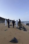 This image provided by the International Organization for Migration shows authorities intervening after a migrant ship capsized near Guhere, north of Obock, in Djibouti, Saturday, Oct. 11, 2026. (Alexandre Coissac/IOM via AP)