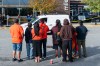 Members of the Tsawwassen First Nation line the street as the bodies of two victims are taken away at Tsawwassen Mills shopping centre after a truck, back right, hit four people, killing two of them in Delta, B.C., on Wednesday, Sept. 30, 2026. Police say the driver may have experienced a medical emergency. THE CANADIAN PRESS/Rich Lam