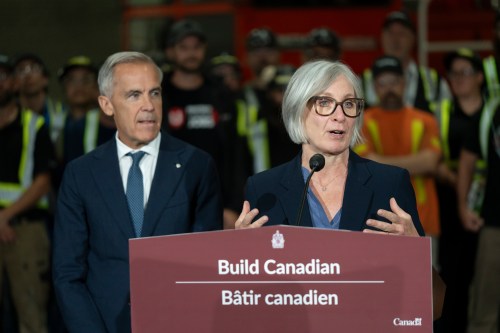 MP Patty Hajdu speaks ahead of Prime Minister Mark Carney, left, during a visit to the Alstom Plant in Thunder Bay, Ontario, on Thursday, Sept. 3, 2026. THE CANADIAN PRESS/David Jackson