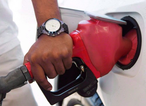A person pumps fuel in Toronto after gasoline prices rose overnight on Wednesday, September 12, 2012. THE CANADIAN PRESS/Michelle Siu