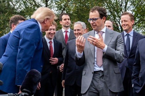 President Donald Trump, left, looks at Dario Amodei, CEO and co-founder of Anthropic as he speaks with reporters outside the West Wing of the White House, Tuesday, Sept. 29, 2026, in Washington. (AP Photo/Alex Brandon)