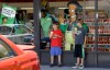 FILE - Children appear next to a window display featuring 