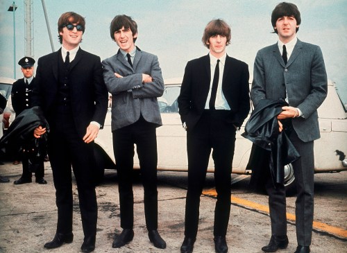 FILE - The Beatles, from left, John Lennon, George Harrison, Ringo Starr and Paul McCartney, arrive in Liverpool, England, on July 10, 1964, for the premiere of their movie 