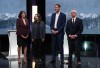 Moderator Shachi Kurl, from left to right, B.C. Green Party Leader Emily Lowan, B.C. NDP Leader David Eby and B.C. Conservative interim Leader Lorne Doerkson stand together after the televised B.C. Leaders' Debate ahead of the provincial election, in Vancouver, on Wednesday, Oct. 14, 2026. THE CANADIAN PRESS/Darryl Dyck