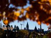 The Canadian flag on the Peace Tower on Parliament Hill is seen past autumn leaves as it flies at half mast to mark the incident at CFB Wainwright, in Ottawa, on Monday, Oct. 19, 2026. THE CANADIAN PRESS/Justin Tang