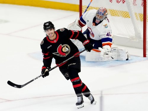 Ottawa Senators' Shane Pinto (12) sticks out his tongue as he celebrates his goal against New York Islanders goaltender Semyon Varlamov (40) in the shootout of NHL hockey action in Ottawa, on Thursday, Oct. 15, 2026. THE CANADIAN PRESS/Justin Tang
