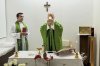 This picture, released by Vatican Media on Friday, Oct. 16, 2026, shows Pope Leo XIV, flanked by his personal secretary, Monsignor Edgard Iván Rimaycuna Inga, left, celebrating Mass at the Agostino Gemelli Polyclinic in Rome, where he is recovering after having cancer removed from his right lung. (Vatican Media via AP)