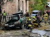 In this photo provided by the Ukrainian Emergency Service, emergency services personnel work in residential neiboorhud following a Russian air attack in Kyiv, Ukraine, Thursday, Oct. 15, 2026. (Ukrainian Emergency Service via AP)