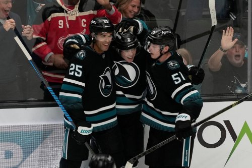 San Jose Sharks center Will Smith, middle, is congratulated by defenseman Darnell Nurse (25) and right wing Collin Graf (51) after scoring against the Vancouver Canucks during the third period of an NHL hockey game, Thursday, Oct. 29, 2026, in San Jose, Calif. (AP Photo/Jeff Chiu)