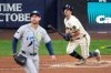 Milwaukee Brewers' Sal Frelick watches his home run during the sixth inning of Game 2 of baseball's World Series, Saturday, Oct. 24, 2026, in Milwaukee, between the Milwaukee Brewers and the Tampa Bay Rays. (AP Photo/David J. Phillip)