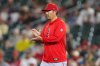 Los Angeles Angels manager Kurt Suzuki walks to the mound as he makes a pitching change during the fifth inning of a baseball game against the Athletics Wednesday, Sept. 23, 2026, in West Sacramento, Calif. (AP Photo/Scott Marshall)