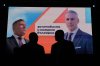 Posters featuring independent presidential candidate Andrey Gyurov and his vice-presidential running mate, Georgi Kandev are displayed on screens during their campaign's closing event in Plovdiv, Bulgaria, on Oct. 21, 2026. (AP Photo/Valentina Petrova)