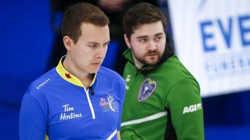 Team Alberta skip Brendan Bottcher, right, contemplates a shot as Team Saskatchewan skip Matt Dunstone looks on during the semifinal at the Canadian men's curling championship in Calgary on March 14, 2021.THE CANADIAN PRESS/Jeff McIntosh