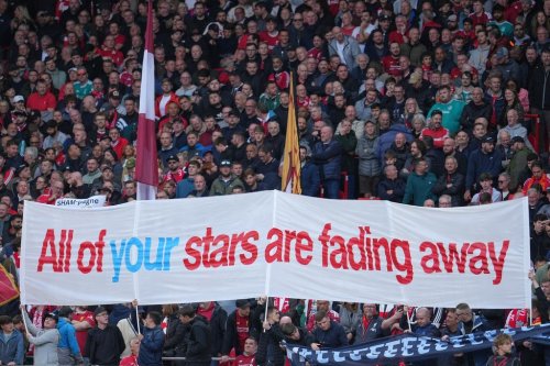Fans display a banner as they cheer at the stand prior the English Premier League soccer match between Liverpool and Manchester City in Liverpool, England, Sunday, Oct. 11, 2026. (AP Photo/Jon Super)