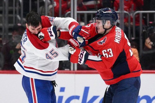 Washington Capitals left wing Ivan Miroshnichenko (63) scuffles with Montreal Canadiens defenseman Alexandre Carrier (45) during the second period of an NHL hockey game, Wednesday, Oct. 14, 2026, in Washington. (AP Photo/Nick Wass)