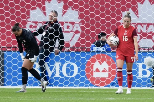 Canada goalkeeper Kailen Sheridan, left, and teammate Janine Sonis react after Denmark's Olivia Holdt, not shown, scored her country's third goal during an international women's soccer friendly in Toronto on Oct. 12, 2026. THE CANADIAN PRESS/Chris Young