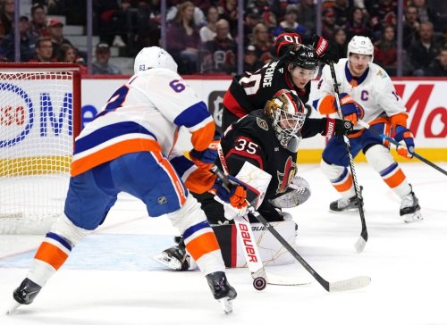 Ottawa Senators goaltender Linus Ullmark (35) makes a save as New York Islanders' Matias MacCelli (63) looks for a piece of the puck, during first period NHL hockey action in Ottawa, on Thursday, Oct. 15, 2026. THE CANADIAN PRESS/Justin Tang