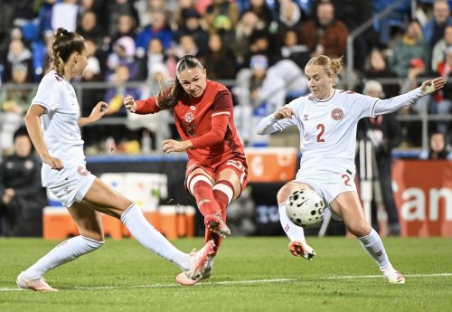 Denmark's Sara Thrige (2) and Selma Svendsen, left, defends against Canada's DB Pridham during second half international friendly soccer action in Montreal, on Friday, Oct. 9, 2026. THE CANADIAN PRESS/Graham Hughes