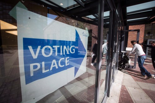 People enter a municipal election polling station in Vancouver, on Saturday, Oct. 20, 2018. THE CANADIAN PRESS/Darryl Dyck