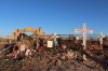 FILE - Crosses, flowers and other mementos are displayed outside Jeffrey Epstein's former Zorro Ranch near Stanley, N.M., on April 3, 2026. (AP Photo/Savannah Peters, File)