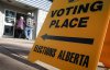 Voters arrive to cast their referendum vote at an advance polling station in Calgary, Tuesday, Oct. 13, 2026. THE CANADIAN PRESS/Jeff McIntosh