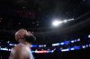 Philadelphia 76ers' LeBron James tosses chalk into the air before an NBA basketball game against the Cleveland Cavaliers Thursday, Oct. 22, 2026, in Philadelphia. (AP Photo/Matt Slocum)